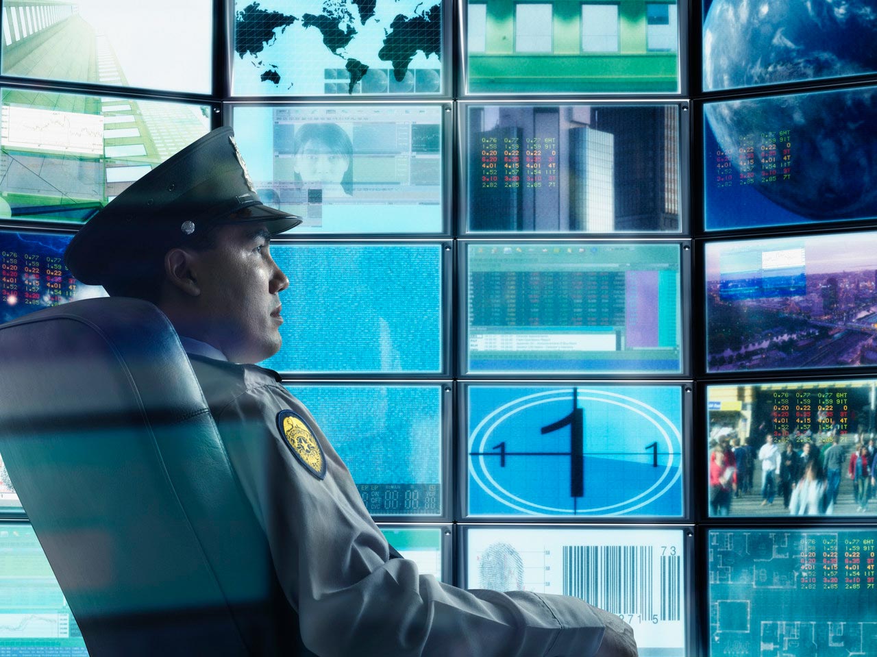 Man watching surveillance cameras