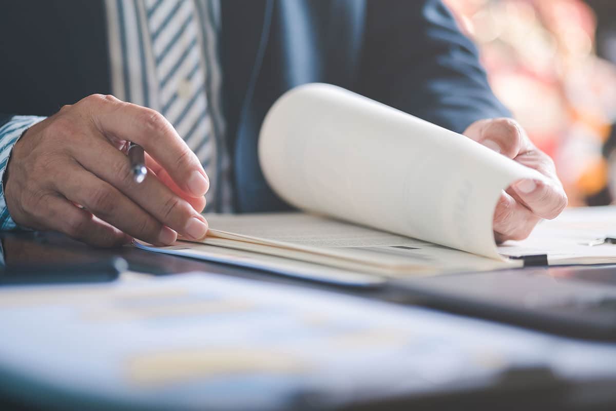 Business man filling out paperwork