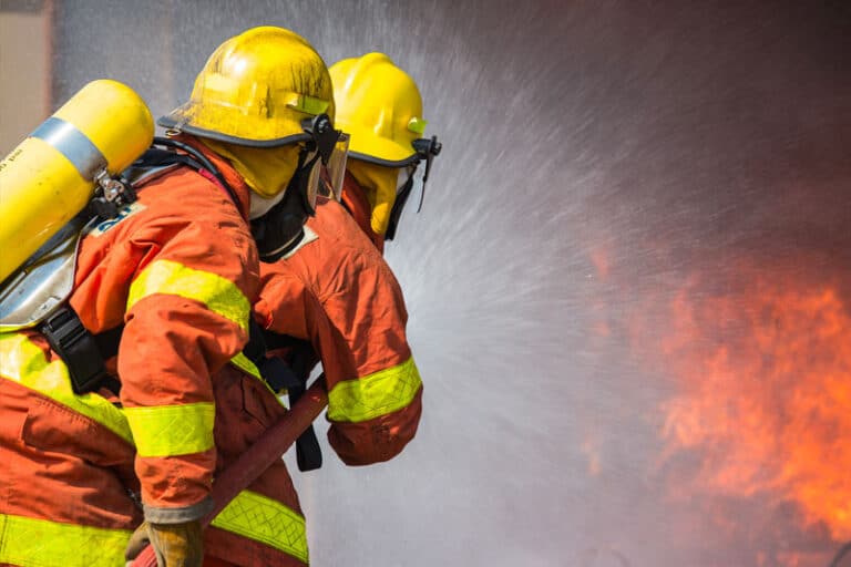 Two firemen fighting fires